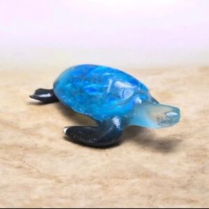 Teal blue sea turtle with black flippers epoxy